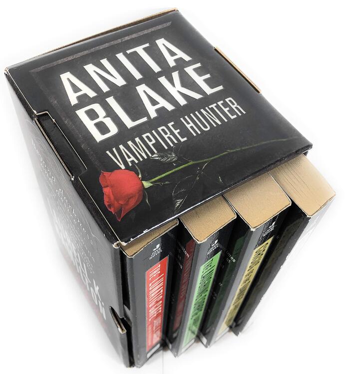 Laurell K. Hamilton - Anita Blake: Vampire Hunter Boxed Set; Books 1-4 (Guilty Pleasures, The Laughing Corpse, Circus of the Damned and The Lunatic Cafe) (used)